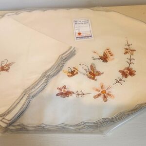 Vintage embroidered cloth placemats and napkins.  Set of 6 each.